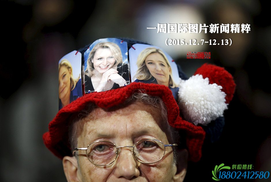 当地时间2015年12月9日,法国马赛,马琳·勒庞支持者头戴印有马琳·勒庞肖像的帽子出席地方选举。