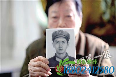 家中保留着何田忠烈士的遗像